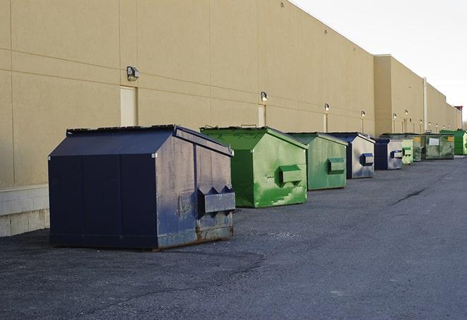 large roll-off dumpsters prepared for construction waste in Mayfield